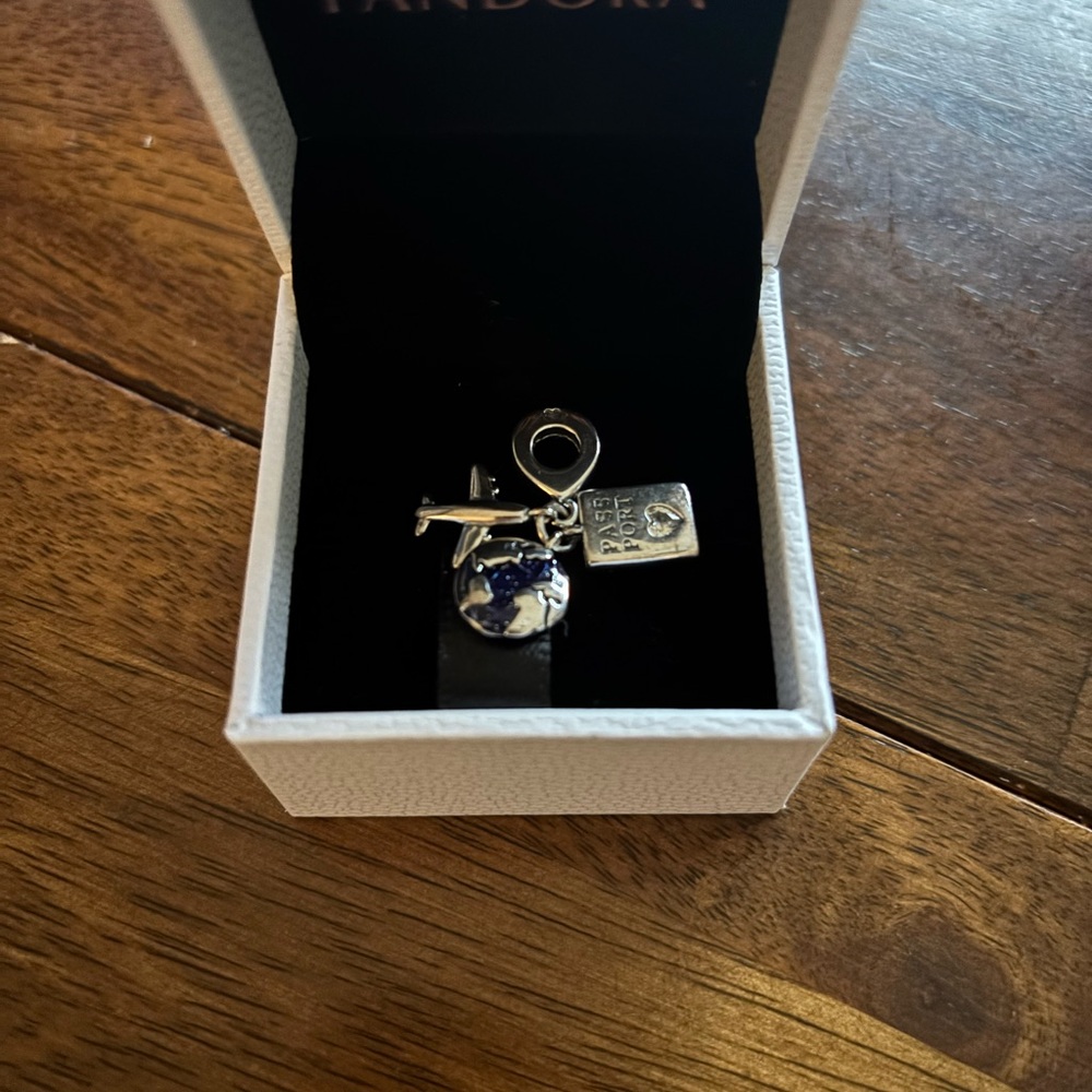 New in Box Pandora Silver Charm with Blue Globe passport and Airplane